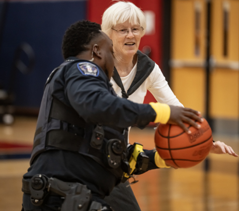 Georgetown Police Department officer Erron Oliver, left, tries to get past Terri Blackledge, a member of the  Granny Basketball Team, the Texas Fire Ants, during a matchup held against the police department  at East View High School on Saturday, January 17, 2026.  The game, won by the Fire Ants, with a final score of 55-47,  benefits the Carver Center for Families.      Photo by Andy Sharp.