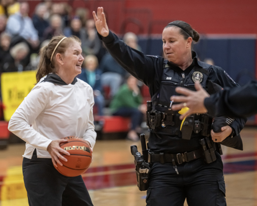 Texas Fire Ants player Julie Currie, left, tries to get past Georgetown Police Department officer Kandice Ellis during a matchup pitting the Fire Ants against the Georgetown Police Department, held at East View High School on Saturday, January 17, 2026.  The game, won by the Fire Ants, with a final score of 55-47,  benefits the Carver Center for Families.      Photo by Andy Sharp.
