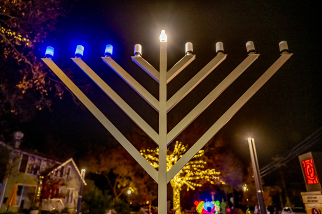 A Menorah placed by Beit Messiah of Georgetown, TX is pictured at Founder’s Park  on Tuesday, December 16, 2025.  The congregation’s Lights of Hanukkah will hold events here on December 20th and December 21st beginning at 6p.m. each night.   Seasonal lights are abundant in Downtown Georgetown this year.  Photo by Andy Sharp. 
