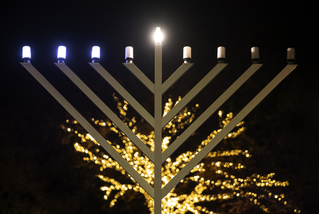 A Menorah placed by Beit Messiah of Georgetown, TX is pictured at Founder’s Park  on Tuesday, December 16, 2025.  The congregation’s Lights of Hanukkah will hold events here on December 20th and December 21st beginning at 6p.m. each night.   Seasonal lights are abundant in Downtown Georgetown this year.  Photo by Andy Sharp.