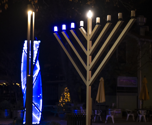 A Menorah placed by Beit Messiah of Georgetown, TX is pictured at Founder’s Park  on Tuesday, December 16, 2025.  The congregation’s Lights of Hanukkah will hold events here on December 20th and December 21st beginning at 6p.m. each night.   Seasonal lights are abundant in Downtown Georgetown this year.  Photo by Andy Sharp.