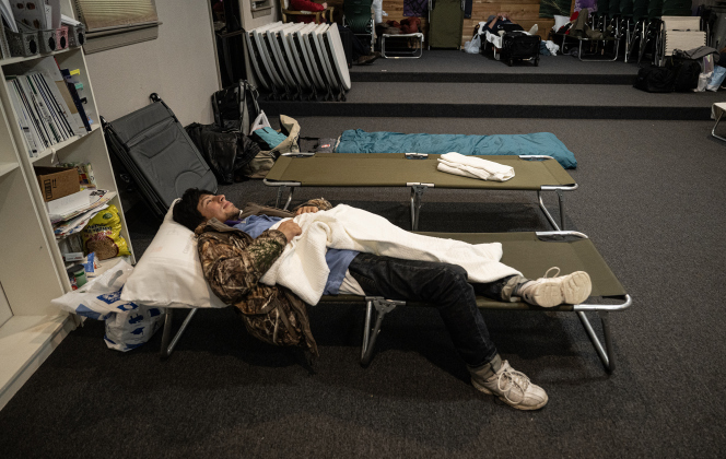Felipe Nuñez finds a warm place to sleep at Getsemani Center on Friday night, January 23.  