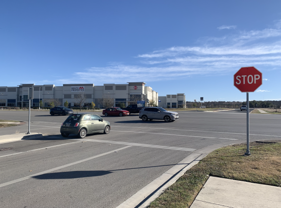 Cars on January 14 pass the Snead Drive/Blue Springs intersection with SE Inner Loop, one block east of Austin Avenue and Interstate 35. A traffic signal and median will be added to the area in the future to improve safety. (Photo by Kaitlyn Wilkes)