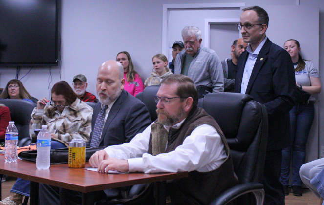 Former Police Lieutenant David Guthrie, right, and his lawyer Robert McCabe, left, appeal Mr. Guthrie’s at-will termination on January 20 during the February 10 Special Called Florence City Council meeting. Photo by Nalani Nuylan.