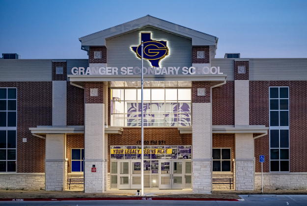 Granger Secondary School, along FM 971 east of downtown Granger, is pictured on Sunday, February 22, 2026. The face of a lion, the school mascot, can be seen inside.  from a distance.  After a long delay to work on water issues the school will open for classes on March 2, 2026.    Photo by Andy Sharp. 