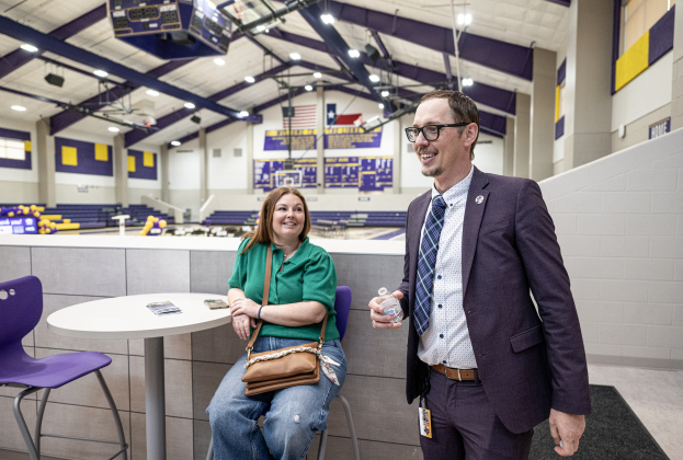 Kody Hajda, left, mom of students in Granger, visits with Granger ISD Superintendent Stephen Brosch in the gymnasium area of  the new Granger Secondary School during an open house on Wednesday, February 25, 2026. Photo by Andy Sharp