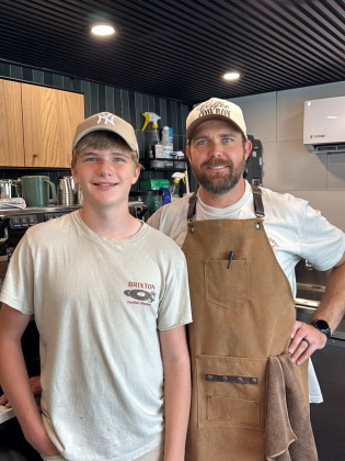 Cael Amason stands with his dad, Travis Amason, in Lone Horse Coffee truck on June 15. Photo Courtesy of Tonya Amason
