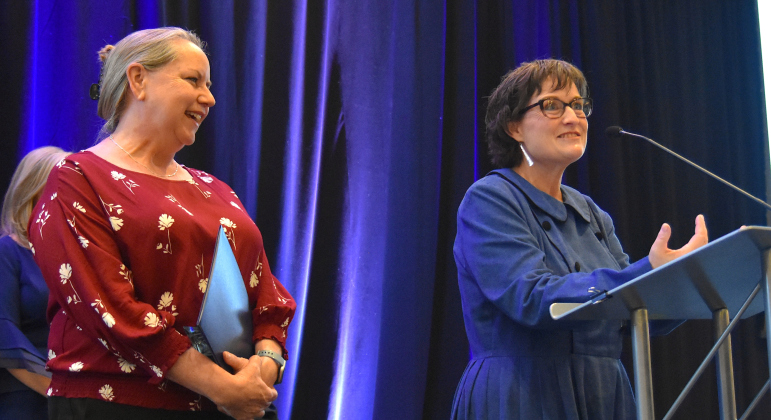 Suzy Pukys, left, vice president of strategic philanthropy at the Georgetown Health Foundation, and Nita Riggins, right, the director of the Carver Center for Families, accepted the Jesse “Buz” Sawyer Philanthropy Award for the Carver Center at the annual Georgetown Chamber of Commerce business awards.