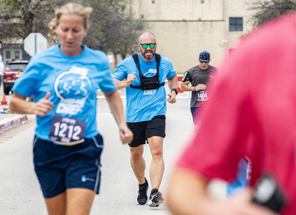 Georgetown Police Chief Cory Tchida (center) nears the finish line in the 5K Run during the annual Chase The Chief races held at East View High School on Sunday, March 8, 2026.