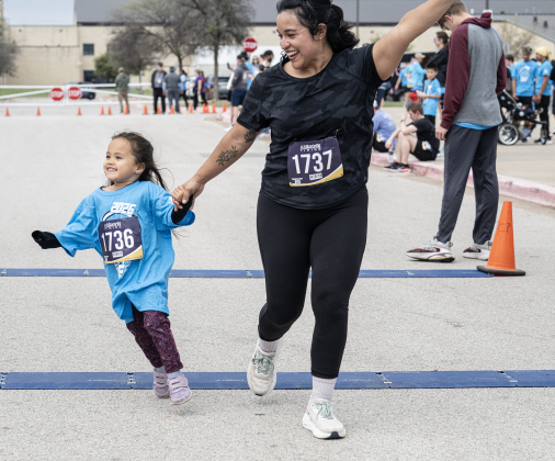 Sarah Sims and her daughter Maisey, 4, cross the finish line for their 5K Run during the annual Chase The Chief races held at East View High School on Sunday, March 8, 2026.