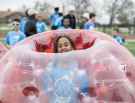 Frost Elementary School student  Camilla Warwick, 8, had fun bouncing around in Bumper Balls, one of the kids’ activities taking place on the athletic field before the annual Chase The Chief races held at East View High School on Sunday, March 8, 2026.