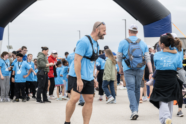 Police Chief Cory Tchida congratulates Fun Run finishers during  the annual Chase The Chief races held at East View High School on Sunday, March 8, 2026.