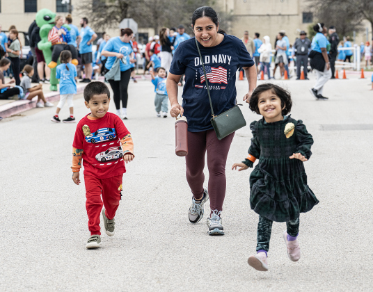 Mom Deepti Bajaj finishes the Fun Run with her children, including Mohaun, left, and his sister Aayra, right, both 3 (they’re two of three triplets) during  the annual Chase The Chief races held at East View High School on Sunday, March 8, 2026.