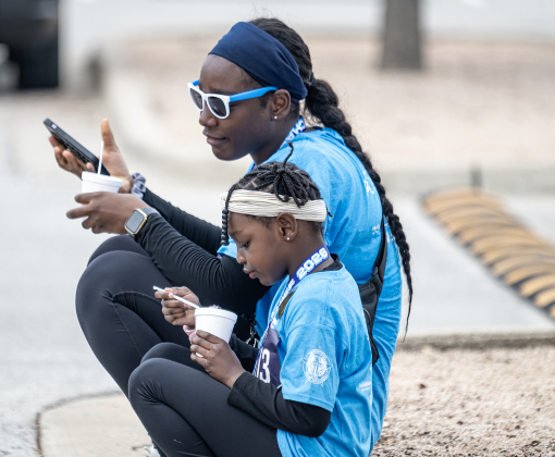 Agnes Galimah and her daughter Ava Adelakun, 6, relax together with icy treats after taking part in the 5K Run together during the annual Chase The Chief races held at East View High School on Sunday, March 8, 2026. A Fun Run, followed by a 5K Run were held Sunday afternoon, with proceeds benefitting physical education programs in the Georgetown Independent School District.   1994 entrants participated in the day’s events.    Photo by Andy Sharp.