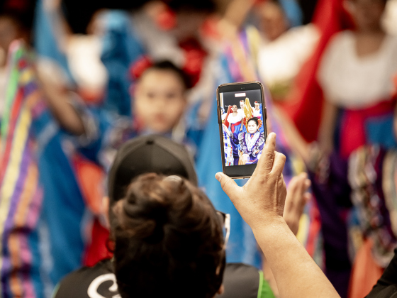 Antonia Rivera uses her phone to record the performance of her granddaughter Jailyne Codero, 10, a student at Williams Elementary School,  during a performance by the Georgetown ISD Ballet Folklorico Troupe at the Georgetown ISD State of the District gathering held at the Future Ready Complex on Friday, March 6, 2026.