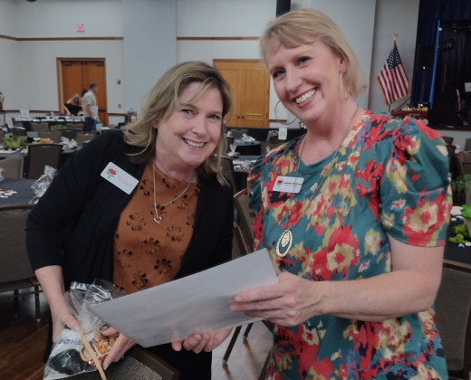 Gift of Time Executive Director Becky Folta-May and Activities Coordinator Jeanette Workman review seating arrangements before the start of the F7 Group Foundation’s March 5 gala that drew more than 320 people to the Sun City Ballroom.