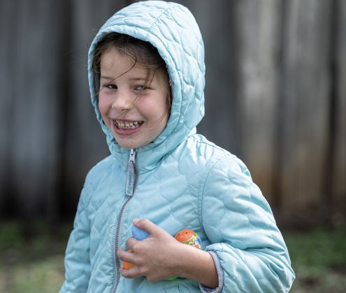 5-year-old Susan Atherton smiles after collecting Easter Eggs placed on the grounds  at the Old Settlers Association  site during The Williamson Museum’s Hoppy Easter event on Saturday, March 14, 2026.    Photo by  Andy Sharp.