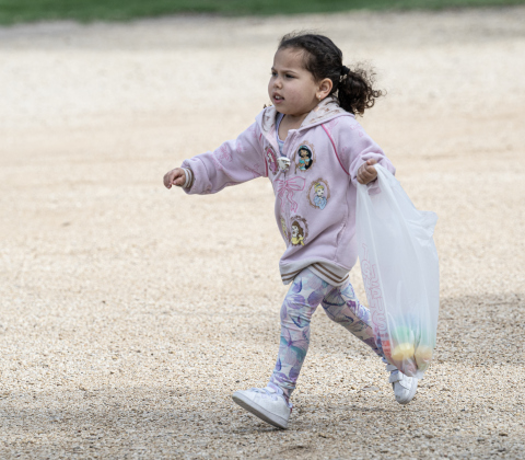 4-year-old Celeste  Gualtieri gathers Easter Eggs placed on the grounds  at the Old Settlers Association  site during The Williamson Museum’s Hoppy Easter event on Saturday, March 14, 2026.