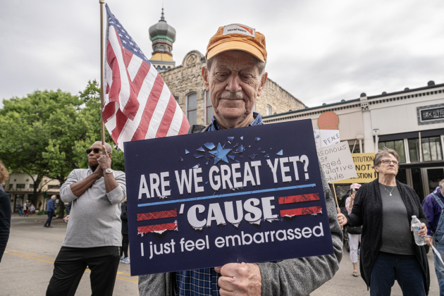 Tom Mulhearn, front, joined by Tony (first name only) carrying  an American flag, attended the No Kings rally held in downtown Georgetown on Saturday, March 28, 2026.