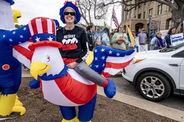 Tina Mangrum, greeting passersby along Austin Avenue,  was dressed as an eagle  at the No Kings rally held in downtown Georgetown on Saturday, March 28, 2026.  Approximately 700 people attended the rally, a demonstration opposed to the current Presidential administration of Donald Trump.  Photo by  Andy Sharp.