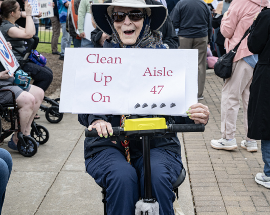 Lettie Lee, who will be 85 in two weeks, was among the attendees  at the No Kings rally held in downtown Georgetown on Saturday, March 28, 2026.  Approximately 700 people attended the rally, a demonstration opposed to the current Presidential administration of Donald Trump.  Photo by  Andy Sharp.