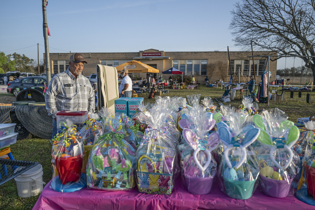 Darvin Bamsch looks over a large collection of Easter baskets for sale at the Jonah and Weir Community Sale, held at the Jonah Community Center on Saturday, March 22, 2025.