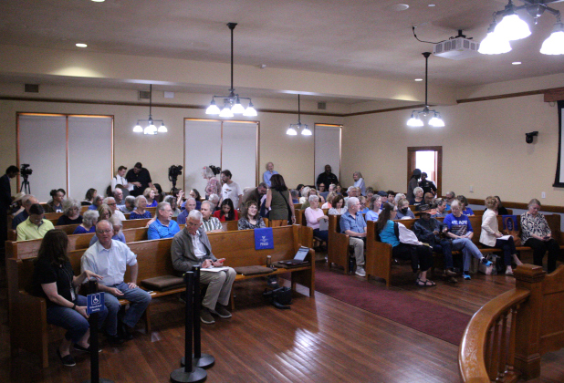 About 100 residents pack the Commissioners Court room Teusday afternoon to find answers and air grievances regarding the Primary Election. Photo by Nalani Nuylan.