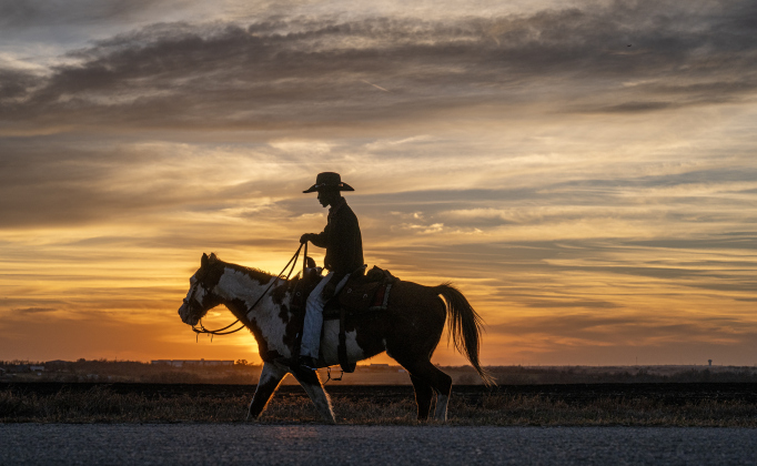 Khrystofer Washington and his horse Dakota enjoy a peaceful evening ride as sunset nears along Justin Lane on Wednesday, February 25, 2026.     Photo by Andy Sharp.
