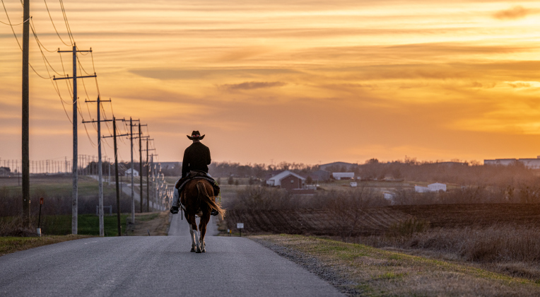 Khrystofer Washington and his horse Dakota enjoy a peaceful evening ride as sunset nears along County Road 398  on Wednesday, February 25, 2026.     Photo by Andy Sharp.