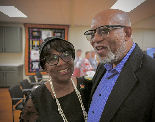 Paulette Taylor catches up with Ron Swain, the chaplain at Southwestern University, during her room dedication ceremony. (Photo courtesy David Valdez)