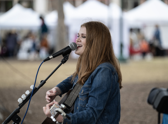 Elle Townley, 16, performed along Seventh Street on Saturday, March 8, 2025,  in downtown Georgetown. Photo by Andy Sharp.  
