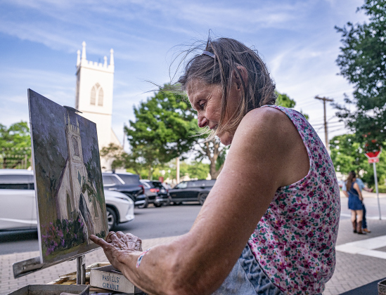 Artist Jan Frazier works on a painting of Grace Heritage Center along Main Street during the City of Georgetown’s Arts and Culture Program's Art Stroll on Friday, April 17, 2026.   Photo by  Andy Sharp. 
