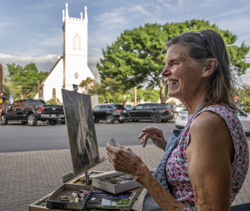 Artist Jan Frazier works on a painting of Grace Heritage Center along Main Street during the Art Stroll on Friday, April 17, 2026.   Photo by  Andy Sharp.
