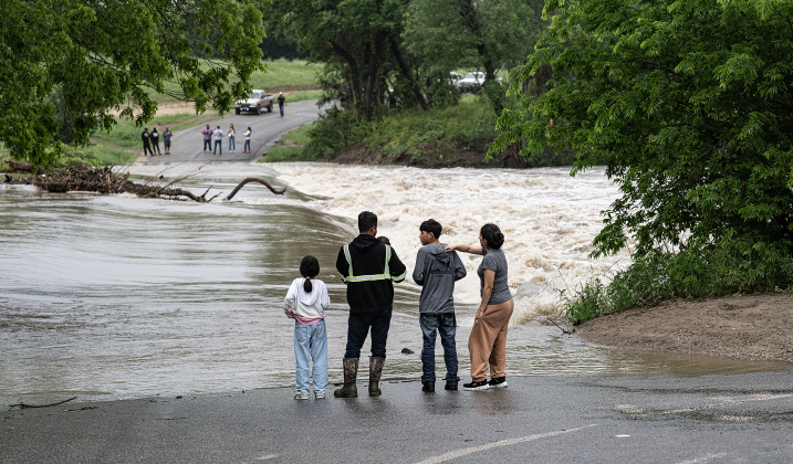 County Road 100 at Mankin’s Crossing was impassable as the San Gabriel River covered the bridge at approximately 6:30pm on Tuesday, April 21, 2026. Rain was present throughout the day in Williamson County, closing some of the area’s roads.      Photo by  Andy Sharp. 