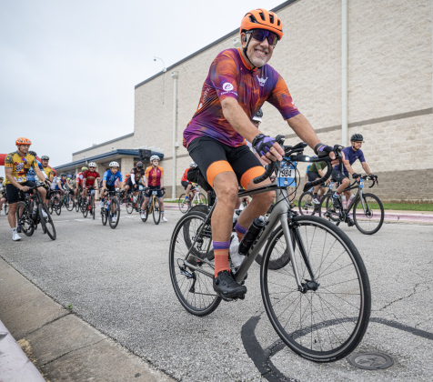 Cyclists are rolling from the starting line during  this year’s Red Poppy Bike Ride, starting and finishing in the parking area behind Georgetown High School on Saturday morning, April 25, 2026.  600 cyclists were registered for the event, which included rides of 14, 30, 40 60 and 100 miles. Coordinated by the Georgetown Sertoma Club, the ride benefits the Williamson County Children’s Advocacy Center.      Photo by  Andy Sharp.