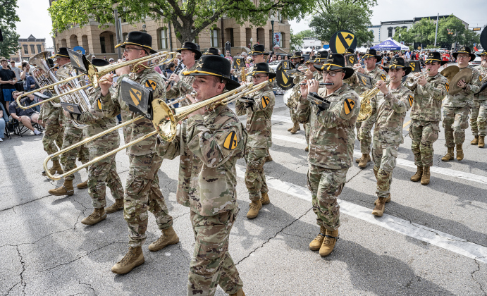 Members of Fort Hood’s 1st Cavalry Band perform along Austin Avenue in the Red Poppy Festival parade on Saturday, April 25, 2026.   Photo by  Andy Sharp.