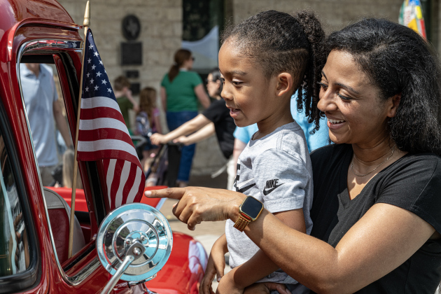 Ashya Batiste and her son Tashi, 5, enjoyed looking at car show entry, a 1957 Chevrolet truck owned by Janie and Corky Lien during the Red Poppy Festival  on Saturday, April 25, 2026.   Photo by  Andy Sharp.