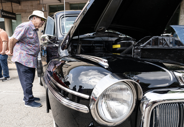 Wayne Thomas admires a 1948 Mercury, a car show entry at  Red Poppy Festival  on Saturday, April 25, 2026.   Photo by  Andy Sharp.