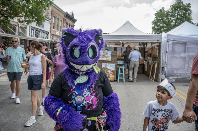 Dressed as a cat, a person who only gave the name “Groovy” was noticed quite a lot as she strolled around the square during the Red Poppy Festival  on Saturday, April 25, 2026.   Photo by  Andy Sharp.