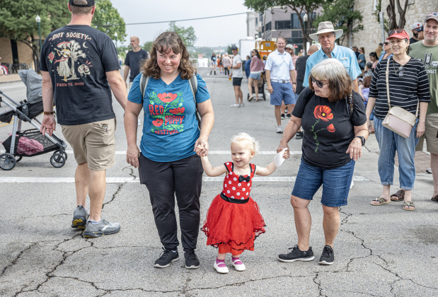 Kate Eberhardt, left, her daughter Zoey, 3, and Kate’s mom Nancy Axtell, right, were in attendance for  the Red Poppy Festival parade on Saturday, April 25, 2026.   Photo by  Andy Sharp.