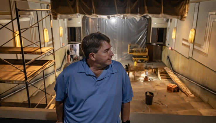 Ron Watson, Executive Artistic Director at the Georgetown Palace, stands in the balcony overlooking the theatre’s seating area at the historic theater on Tuesday, March 31, 2026.