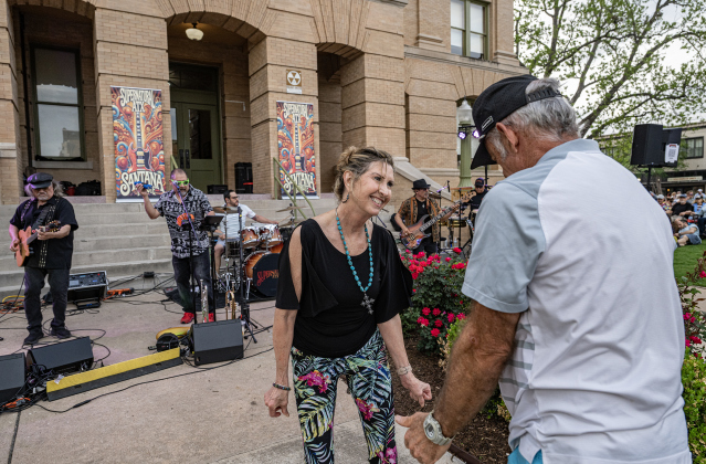 Jamie and Bob McCormick dance to  the music of Supernatural ATX, a Santana Tribute Band, during the first First Friday free concert of the year on the courthouse lawn on Friday, April 3, 2026.  The event was hosted by the Georgetown Beard Club.   Photo by  Andy Sharp. 