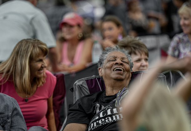 Harriett Fletcher enjoyed listening to the music of Supernatural ATX, a Santana Tribute Band, during the first First Friday free concert of the year on the courthouse lawn on Friday, April 3, 2026.  The event was hosted by the Georgetown Beard Club.   Photo by  Andy Sharp.