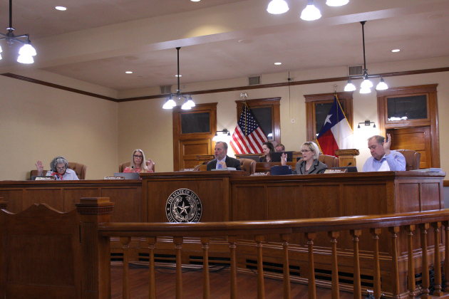 The Williamson County Commissioners Court approves the mid-year creation of a new position for the Elections Department, April 21. Photo by Nalani Nuylan.
