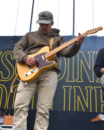Gary Stanton of Muscadine Bloodline plays guitar on Sunday, April 19, during the duo's set on the Big River Stage.