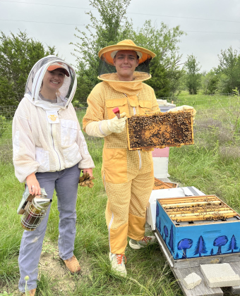 Southwestern students Layla Hoffen and James Cosman are with the club BEE-Co. short for Beekeeping Education and Engagement Community.  Layla Hoffen founded the group. Photo by Linda Dwyer