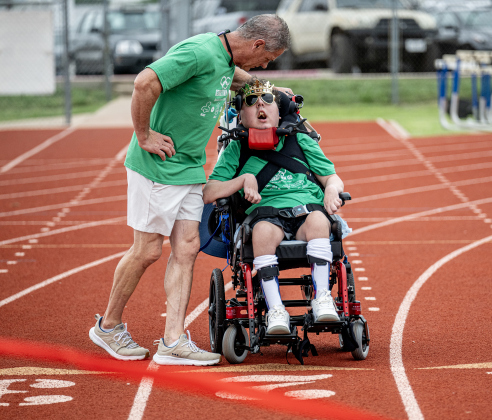 Georgetown High student Cooper Harris is joined by his father Tol Harris as he gets ready to take part in a track event during the Georgetown ISD Special Olympics on Tuesday, May 5, 2026.
