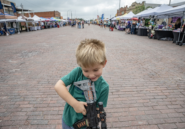 4-year-old Ryder Copeland had fun playing with his toy gun along West Davilla Street during the 47th Annual Granger Lakefest on Saturday, May 9, 2026.   Photo by Andy Sharp.