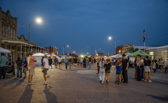 Attendees stroll along the cobblestones of West Davila Street during the 47th Annual Lakefest in downtown Granger on Friday night, May 8, 2026.    Photo by Andy Sharp.