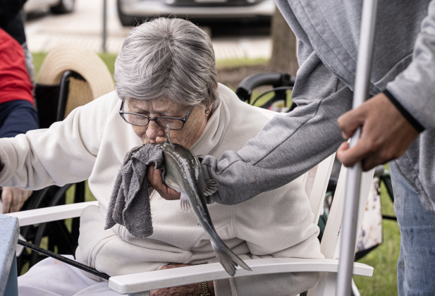 Sybil Naizer bestows a kiss on  one of the catfish she caught during the 23rd Annual SPJST Senior Living Fishing  Tournament on Thursday, May 7, 2026. Senior Living residents fished for 600 pounds of Channel Catfish during the two-day event which continued on Friday.  Residents and staff were treated to a fish fry to celebrate the event.  The fish were provided by Larry’s Fish Farm in Giddings.   Photo by Andy Sharp.